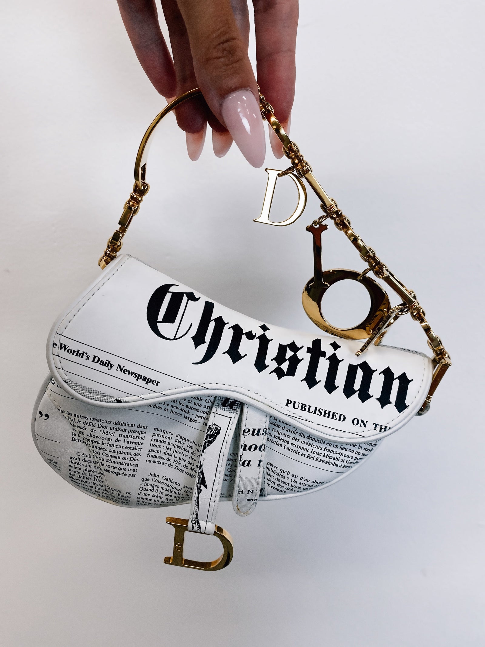 Dior saddle bag newspaper sale